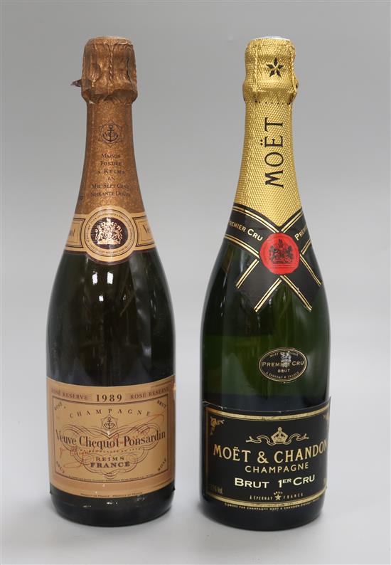 A bottle of Moet & Chandon N.V. and a bottle of Verve Cliquot, 1989